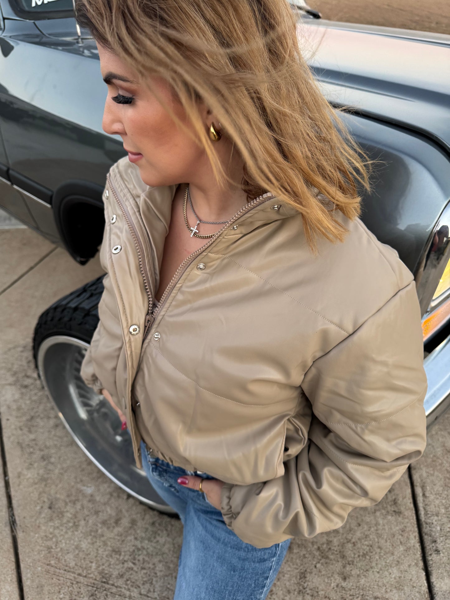 Short Lined Pocketed
Faux Leather Puffers say
