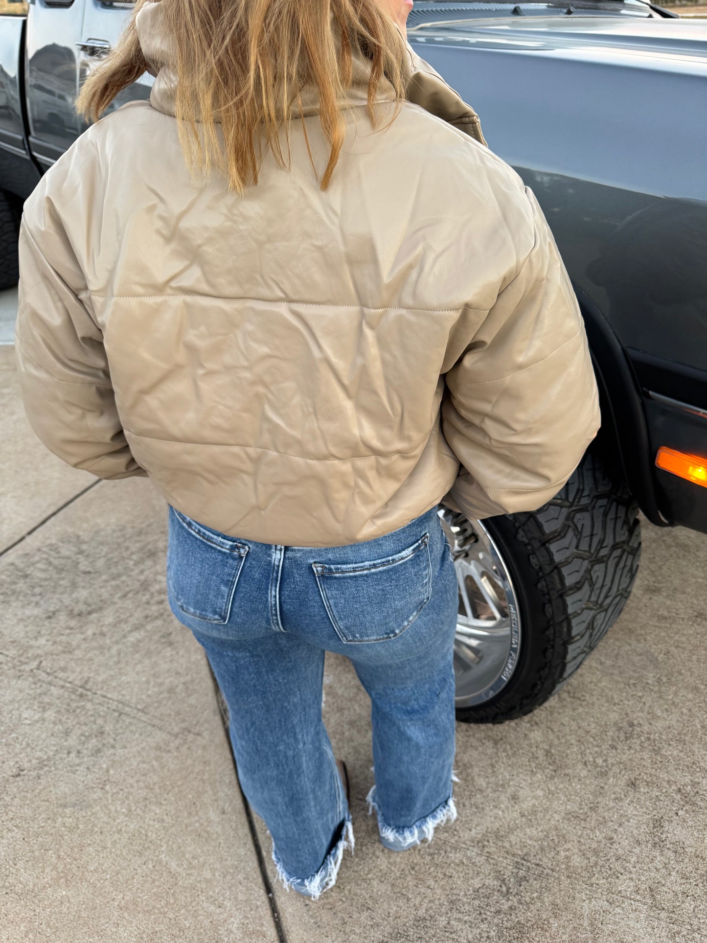 Short Lined Pocketed
Faux Leather Puffers say