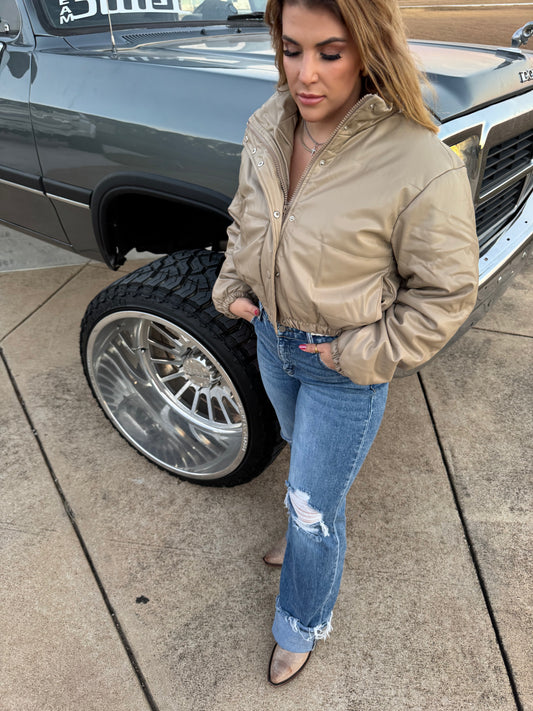 Short Lined Pocketed
Faux Leather Puffers say